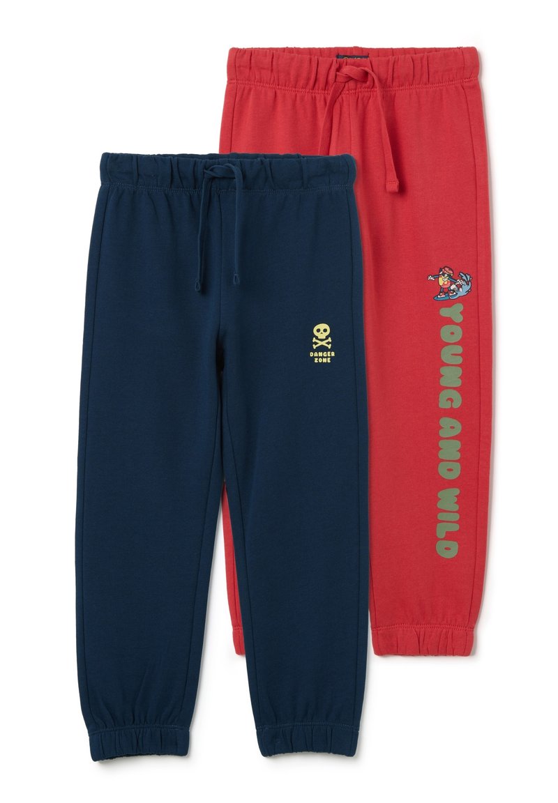 Two pairs of sweatpants: one navy with a yellow skull and "DANGER ZONE," one red with "YOUNG AND WILD" and a cartoon surfer. Elastic waistbands.