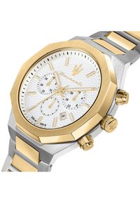 Orologio cronografo in oro e argento con quadrante bianco testurizzato, cassa ottagonale, tre sotto-quadranti e corona prominente. Impermeabile fino a 100 metri.