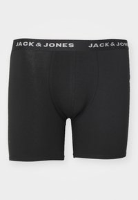 Schwarze Boxershorts aus weichem Material, mit einer enganliegenden Passform und einem elastischen Bund, auf dem "JACK & JONES" in Weiß gedruckt ist.