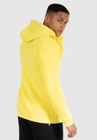 Smilodox Kapuzenpullover - gelb