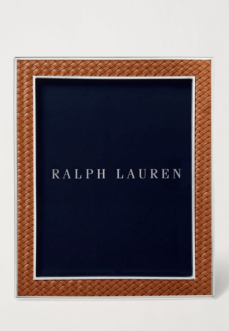 Brown woven leather frame with silver accents surrounding a dark blue background featuring the text "RALPH LAUREN" in silver lettering.