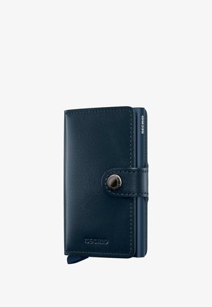 Navy leather wallet with a smooth texture, snap button closure, and a minimalist design; features a small embossed logo. Compact size.