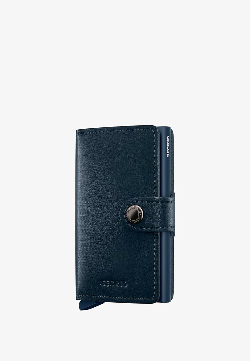 Navy leather wallet with a smooth texture, snap button closure, and a minimalist design; features a small embossed logo. Compact size.