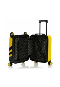 Valigia rigida gialla con accenti neri, design a righe, manico retrattile e ruote multidirezionali. L'interno presenta una fodera decorata e tasche con cerniera.