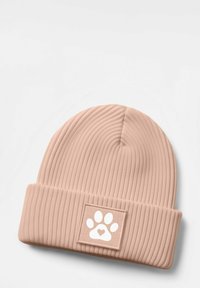 Pink ribbed knit beanie with a folded cuff featuring a square patch with a white paw print and heart design. Soft texture, fitted shape.