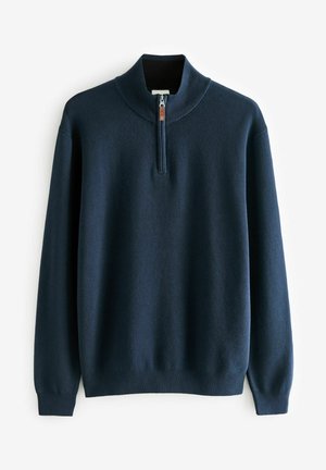 Laivasto sininen vetoketjullinen neulepusero, jossa on korkea kaulus ja puolivetoketju edessä. Valmistettu pehmeästä neulemateriaalista, jossa on ribattu hihansuut ja helma.