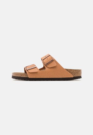 Brown cork footbed sandal with two adjustable straps, textured synthetic upper, and a durable black rubber outsole.