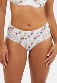 Culotte imprimée florale en blanc, avec une dentelle au niveau de la taille, un nœud décoratif à l'avant et une texture lisse et douce.