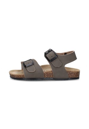 Sandalo in pelle marrone con soletta in sughero, due fibbie laterali regolabili e suola nera, mostrato dal lato sinistro su sfondo bianco.