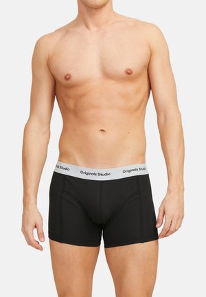 Schwarze Baumwoll-Boxershorts mit einem grauen Bund, der mit "Originals Studio" beschriftet ist. Sie haben ein eng anliegendes Design und eine glatte Textur.