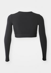 Zwarte crop top met lange mouwen, gemaakt van rekbare stof. Heeft een ronde halslijn en een aansluitend ontwerp met naadloze randen.