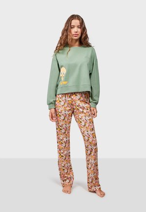 Green sweatshirt with a cartoon character print, paired with pink floral-patterned pants. Casual fit, soft texture, and elastic waistband.