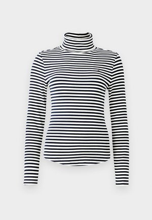 Black and white striped long-sleeve turtleneck with a ribbed texture and fitted design. Small logo on the chest.