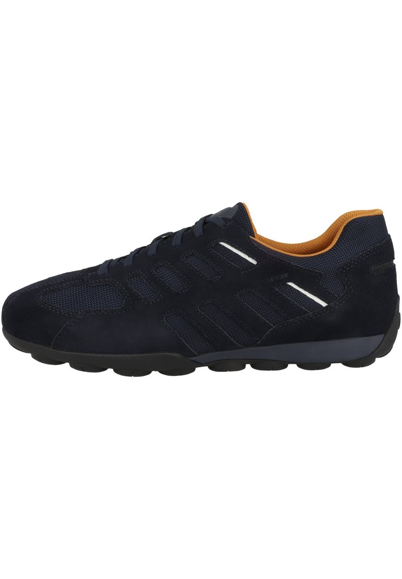 Navy sneaker made of suede and mesh, featuring a textured upper, padded collar, and rubber outsole with six small circular treads.
