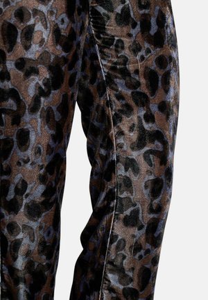 Leggings en velours avec un motif léopard brun et noir, rehaussé de subtils accents bleus ; texture lisse et design ajusté.