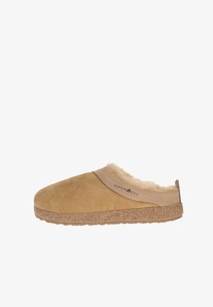 Tan suede slipper with fur lining, cork sole, and a curved mouth. Features a smooth texture and subtle logo detail on the side.