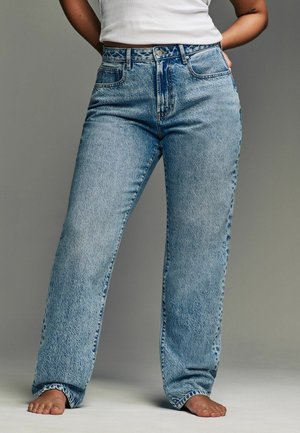 Heledad sinine kõrge vöökohaga denimipüksid, millel on lõdva istuvuse, esikotid, nupu sulguri ja kangal on peene kulumise efekt.