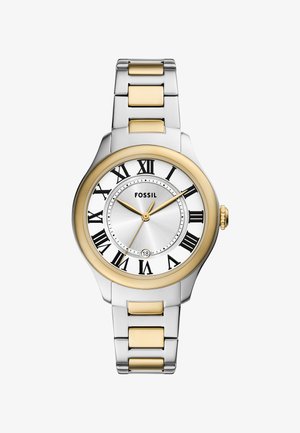 Reloj Fossil con pulsera de metal plateado, acentos dorados, esfera blanca y números romanos. Presenta una ventana de fecha a las 6 en punto y una caja redonda.