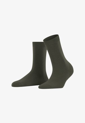 Une paire de chaussettes unies vert foncé mi-mollet avec des poignets côtelés, présentée sur un fond blanc.