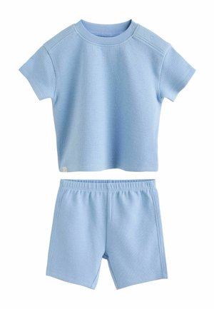 Top a maniche corte in maglia waffle azzurro chiaro con bottoni a pressione sulla spalla e pantaloncini coordinati con vita elastica.