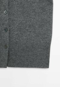 Gray knitted cardigan with four dark round buttons and ribbed hem, shown folded on a white background.
