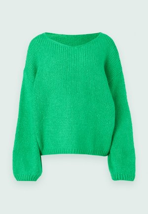 Roheline kudum, millel on lõdva istuvuse, lai kaelus ja pikad varrukad. Tekstuur on soonik, koos turske õmblusmustriga.