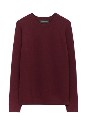Maglione a maglia bordeaux con texture a coste, scollo a girocollo e lunghe maniche raglan. Tessuto morbido con orlo dritto e senza bottoni o decorazioni.