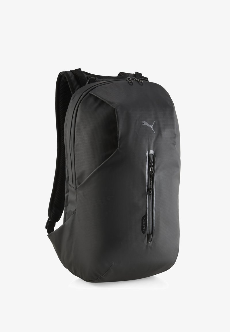 Black backpack with a textured finish, zippered front pocket, padded straps, logo accent, and a streamlined, angular shape.