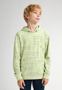 Sudadera verde claro con un patrón de líneas geométricas en negro. Cuenta con un bolsillo tipo canguro y una capucha con cordón. Tejido suave y texturizado.