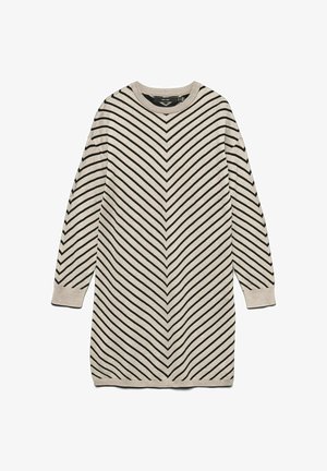 Pletena haljina džemper u svijetlo bež boji s crnim cik-cak prugama. Ima dugi rukav i okrugli okovratnik. Mekana tekstura s rebrastim manšetama.
