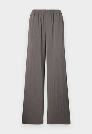 Bredde bukser i et teksturert, mørkegrått stoff. Har elastisk midjebånd og sydd søm.