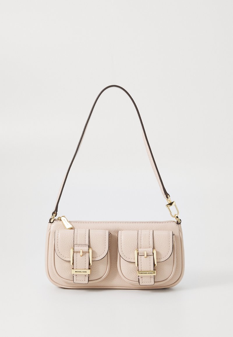 Light beige leather handbag with two front pockets, gold hardware accents, and a dark brown adjustable strap. Rectangular shape with a textured finish.
