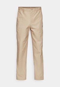 Pantalones beige de pierna recta hechos de una mezcla de algodón. Cierre frontal con botón y bolsillos laterales. Sutil logo de la marca en el lado derecho.