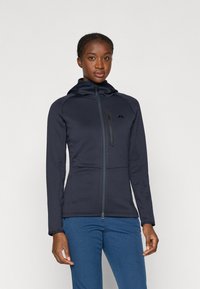Chaqueta de cremallera navy con capucha, hecha de material suave. Cuenta con un bolsillo en el pecho, hombros sin costuras y un diseño ajustado.