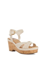 Wedge sandals with a cork sole and a textured, woven white fabric upper. Features crisscross straps and a side buckle for adjustment.