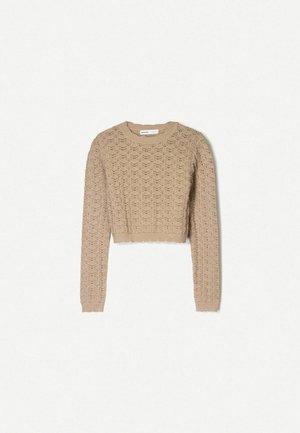 Beige kortärmad tröja med öppen stickning, långa ärmar och rund halsringning. Strukturerad yta med ribbade ärmslut och nederkant.