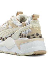 Puma RS-X sneakers featuring a cream and beige color scheme, mesh and suede materials, leopard print accents, and textured rubber sole.