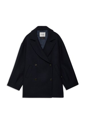 Manteau en laine bleu marine à double boutonnage avec un col cranté, deux poches avant et un tissu texturé subtil. L'intérieur est doublé dans une couleur contrastante.