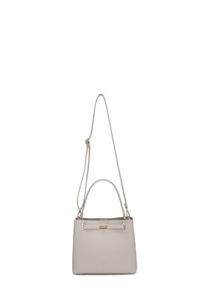 Light beige leather handbag with gold-tone rectangular clasp, top handle, and adjustable long shoulder strap.