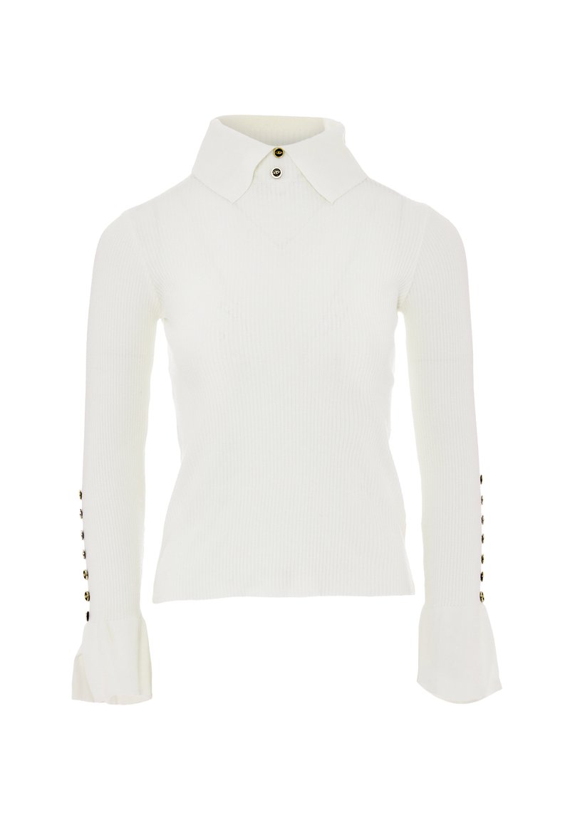 Top bianco a maniche lunghe con colletto classico, caratterizzato da dettagli con bottoni sulle maniche e polsini svasati. Texture liscia.