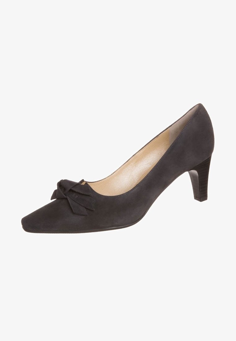 Chaussure pour femme à talon haut en daim noir avec bout pointu et nœud décoratif sur le dessus, dotée d'un talon moyen empilé et d'une doublure intérieure beige.
