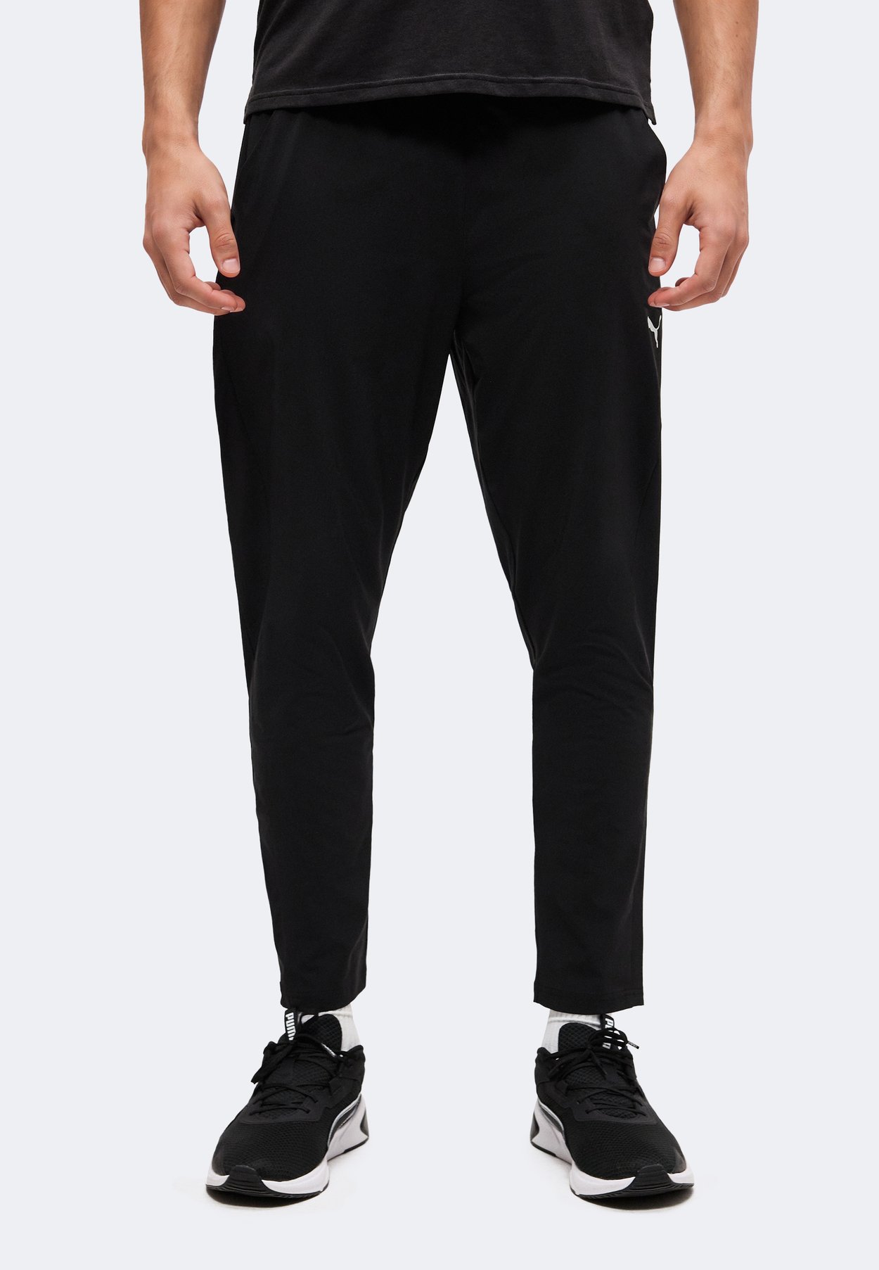PUMA PWRTRAIN - Tracksuit bottoms - black