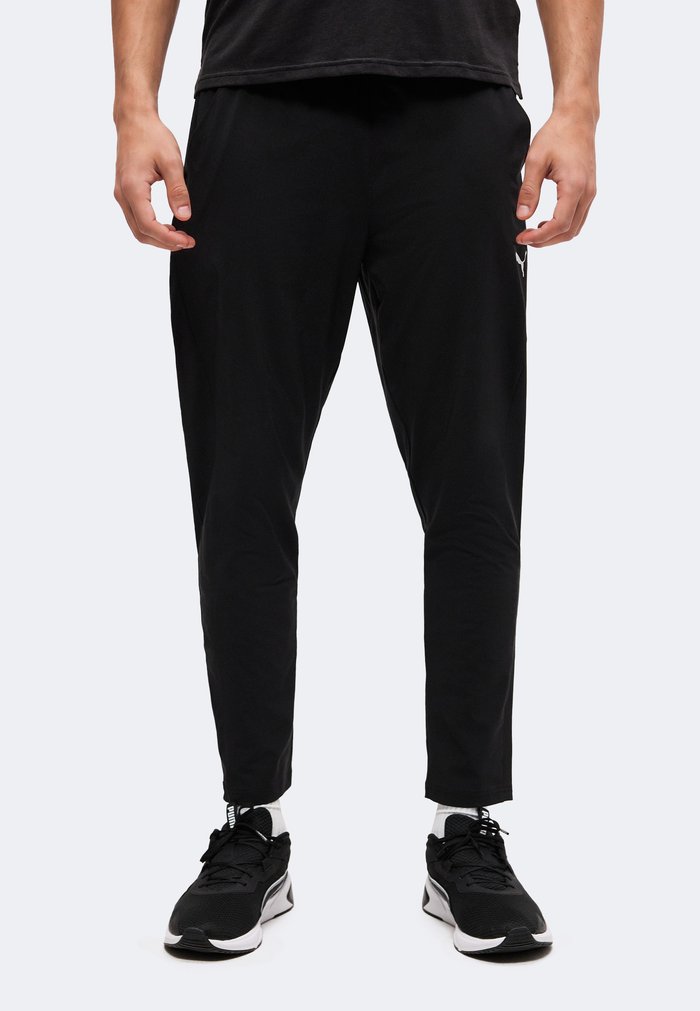 PUMA PWRTRAIN - Tracksuit bottoms - black