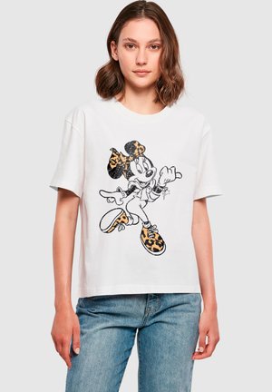 White short-sleeve t-shirt featuring a black outline graphic of a character with a leopard print bow and shoes, paired with blue jeans.
