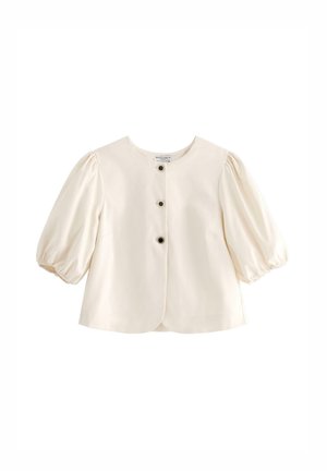 Kreemi puff-sleeve paita, jossa on pyöreä kaula-aukko, kolme mustaa nappia ja rakenteellinen istuvuus. Tasainen kangas, jossa on hienoinen kiilto.