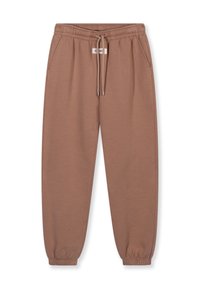 Brune sweatpants lavet af blødt stof, med et elastisk taljebånd med snøring, sidelommer og elastiske manchetter ved anklerne.