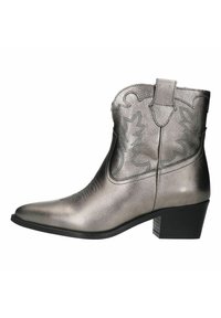 Metallic silver cowboy boot with pointed toe, decorative stitching, pull tabs, and a black block heel. Smooth texture and structured design.