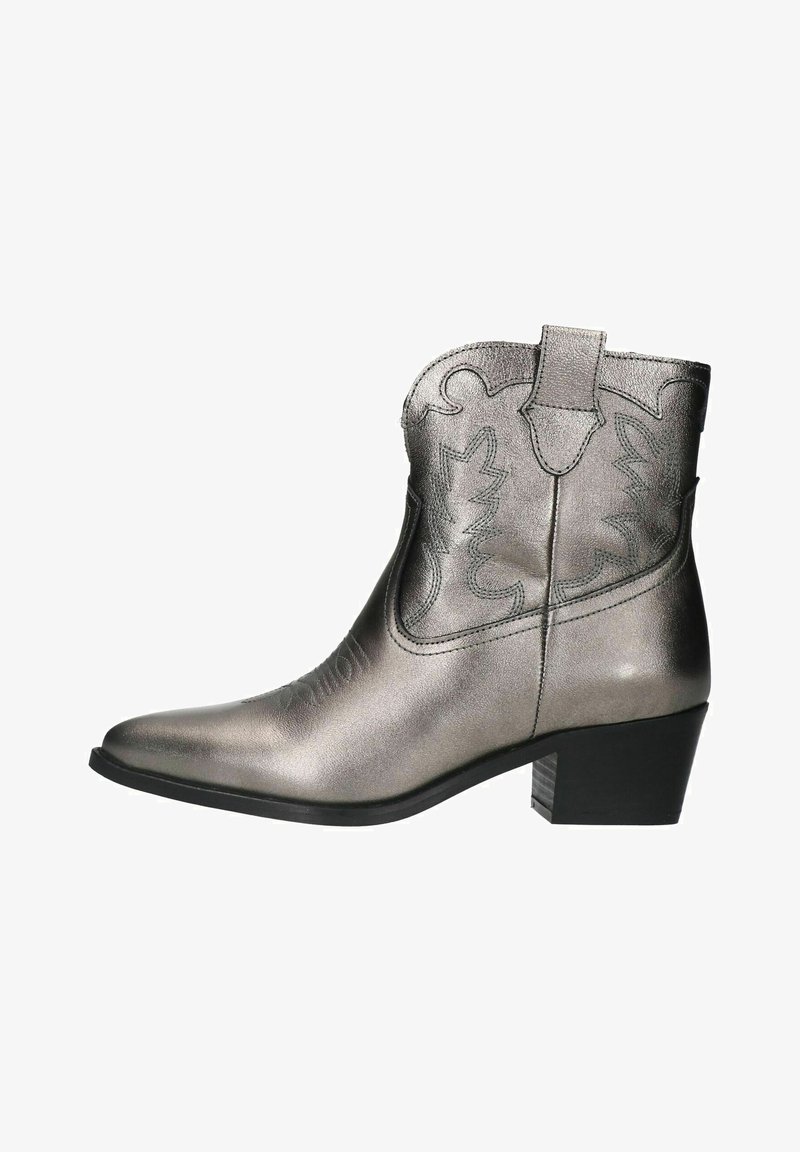 Metallic silver cowboy boot with pointed toe, decorative stitching, pull tabs, and a black block heel. Smooth texture and structured design.