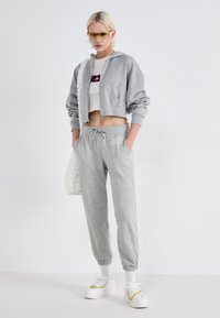GAP HERITAGE - Jogginghose - light heather grey