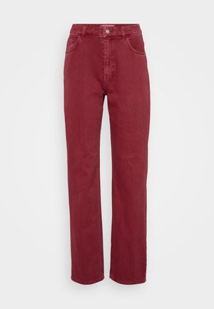 Red denim trousers with a high waist, straight leg design, two front pockets, a button closure, and a smooth, textured fabric finish.